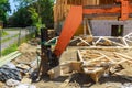 Wood building frame on new residential construction home framing home boom truck forklift in the new home
