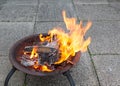 Wood burning brightly in a fire pit Royalty Free Stock Photo