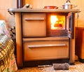 wood burning inside the stove to heat the house or the dishes and pots on the fire Royalty Free Stock Photo