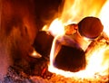 wood burning inside the old stove to heat the house or dishes Royalty Free Stock Photo