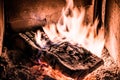 Wood burning in old stove with embers glowing Royalty Free Stock Photo