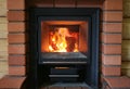 Wood burning in sauna oven. Royalty Free Stock Photo