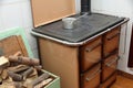 Wood burning stove in a kitchen of a mountain home with a pot on