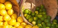 Wood bushels of limes and lemons Royalty Free Stock Photo