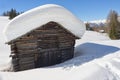 A wood cabin hut in the winter snow background Royalty Free Stock Photo
