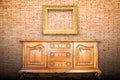Wood cabinet and gold frame Royalty Free Stock Photo