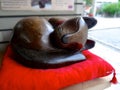 Wood carved cat statue at Tsuyunoten Shrine Ohatsu Tenjin Shrine