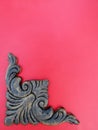 Wood carved corner applique onlay on red background