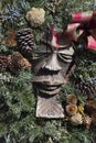 Wood Carved Figure with Christmas Wreath