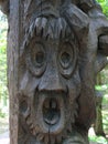 Wood carved frightened face.