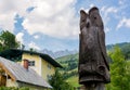 Wood carved owl in picturesque mountain town.