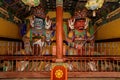 Wood carved statues of two Buddhist deities Royalty Free Stock Photo