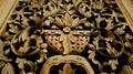 wood carving, floral pattern carved on wooden background. gebyok.