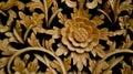 wood carving, floral pattern carved on wooden background. gebyok.