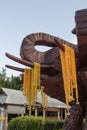 Wood carving head elephant and Yellow plastic flower garland ,Thailand