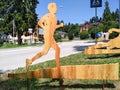 wood carvings with sports images