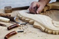 Wood carvings, tools and processes work closeup Royalty Free Stock Photo