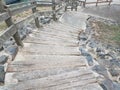 Wood and cement steps going down with railing Royalty Free Stock Photo