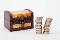 Wood chest and piles of coins