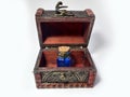 Wood chest with potion blue. old treasure casket isolated on white background. Alchemy set with flasks. small glass bottles with