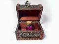 Wood chest with potion pink. old treasure casket isolated on white background. Alchemy set with flasks. small glass bottles with