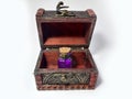 Wood chest with potion violet. old treasure casket isolated on white background. Alchemy set with flasks. small glass bottles with