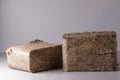 Wood chip briquettes, solid fuel from wood chips and flax. Nature-friendly ecological fuel from renewable resources Royalty Free Stock Photo