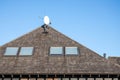 Wood chip roof and skylights. Blue sky Royalty Free Stock Photo