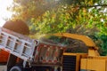 Wood chipper blowing tree branches cut a portable machine used for reducing wood into smaller wood chips Royalty Free Stock Photo