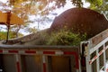 Wood chipper blowing tree branches cut a portable machine used for reducing wood into smaller wood chips Royalty Free Stock Photo