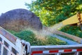 Wood chipper machine the shredded putting the branches leafs into a truck