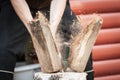 Wood chopping with hand axe Royalty Free Stock Photo