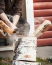 Wood chopping with hand axe Royalty Free Stock Photo