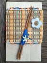 Wood Chopstick on wood board and bamboo mat