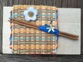 Wood Chopstick on wood board and bamboo mat