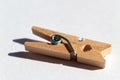 Wood clothespin at white paper Royalty Free Stock Photo