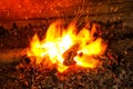 The wood coal burning fire of the furnace.