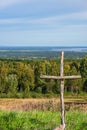 Wood cross in a beautiful landscape