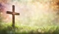 Wood cross in dreamy spring grass with copy space