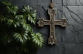 wood cross hanging on a palm leaf on abstract concrete background Royalty Free Stock Photo
