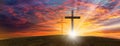 Wood cross of Jesus crucifixion and resurrection with sunset background. Christianity and spiritual concept. Royalty Free Stock Photo