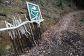 Wood crutches sign roadsign handmade outdoor autumn summer adventure trekking hike sport mountain park nature Royalty Free Stock Photo