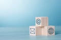 Wood Cubic on table Blue Tone Background with Email Network At sign icon Royalty Free Stock Photo