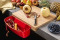 Wood Cutting Board with Waste Container, Santoku Chef Knife and Fresh Fruits