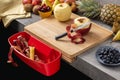 Wood Cutting Board with Waste Container, Santoku Chef Knife and Fresh Fruits