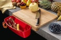 Wood Cutting Board with Waste Container, Santoku Chef Knife and Fresh Fruits