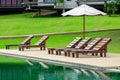 Wood Deckchairs and Beautiful Green Darden Swimming Pool