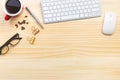 wood desk office with laptop, smartphone and other work supplies with cup of coffee. Top view with copy space for input the text. Royalty Free Stock Photo