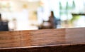 Wood diagonal table with people dinner at restaurant blur background.Empty perspective hardwood bar with blur coffee shop with