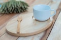 Wood dish and coffe cup on wooden table.with Text Space